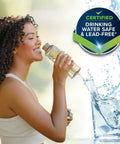 Woman drinking water from a clear bottle beside a round badge reading Certified Drinking Water Safe & Lead-Free.
