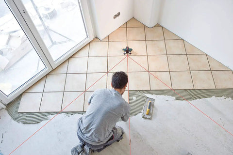 Installer using 65 Feet Wall And Floor Tile Laser Level with 0 to 90 Degree Layout Lines and 45 Degree Beam for Diagonal Layouts