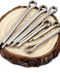 220 Count Stainless Steel Cotter Pins And Hitch Pin Clips Kit displayed on wood slice for axles trailers car repair