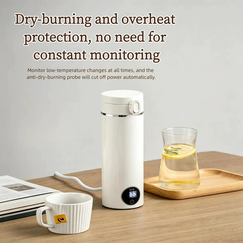 Grab And Go Travel Kettle, 500 Ml Heated Water Cup on a wooden table with a cup and glass of lemon water.