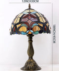 Orange Stained Glass Flower Tiffany Style Table Lamp For Reading Desk And Bedside Use 12 Inch Wide Shade 18 Inch Tall With Antique Green Bronze Base UL Listed Cord Switch Ideal For Bedroom Living Room Or Home Office Decor, full view of lamp on white background.