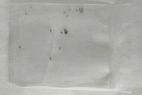 20 Pack M0.6 X P0.15 X D1.2 X L1.5 mm Micro Machine Screws Slotted Head 316L Stainless Steel packaged in a plastic bag