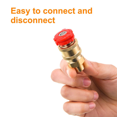 Close-up brass pressure washer quick-connect coupler with red knob, 1/4 in NPT male thread, held in hand