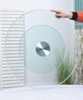 Massive 47 Inch Clear Tempered Glass Lazy Susan Turntable being held, showcasing its smooth swivel design for easy serving.