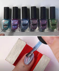 Collection of six ILNP nail polish bottles, various colors, and a person applying colorful magnetic nail polish near a magnet.