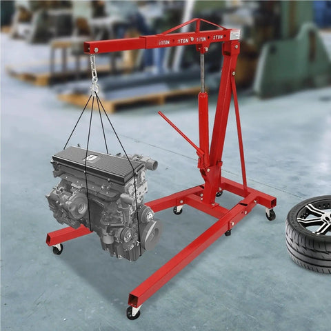 Heavy Duty Carbon Steel Engine Hoist With Smooth Hydraulic Lifting System And Foldable Stand Frame For No Drama Backyard Mechanic Garage Tool Optimization lifting an engine with red frame in workshop.