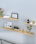 Built Like A Tank Hidden Floating Shelf Brackets 2 Or 4 Pack installed with wooden shelves and decorative items on a wall.