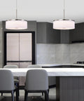Drum Pendant Light With Brushed Nickel Trim And Linen Shade 14 Inch LED Fixture in modern kitchen above island.