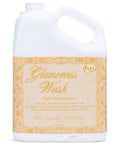 Glamorous Wash High Maintenance Laundry Detergent Gallon 128 Oz Floral Woody Scent Keeps Clothes Smelling Fresh For Everyday Laundry Long Lasting Fragrance Gentle On Fabrics Great For HE Machines in a large white container with an elegant label