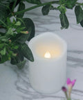 Waterproof Outdoor LED Flameless Candle With Remote And Timer, 3x4 inch white plastic, in garden setting