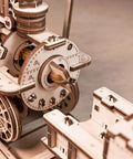 Front view of a wooden mechanical model with gears, wheels and lever, unfinished basswood construction