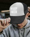 All Day Comfort Mens Breathable Golf Trucker Hat with front artwork "You Sleep I Watch" in outdoor casual style