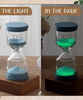 Thirty-minute sand timer glowing in dark and light, part of Nine Colorful Luminous Sand Timers Set With 0.5, 1, 2, 3, 5, 10, 15, 20, 30 Minute Intervals Glow In The Dark Hourglasses For Classroom, Home, Office And Kitchen Decor, Perfect For Timed Tasks, Everyday Fun And Vibe.