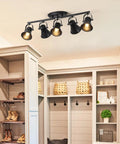 Five Light Track Lighting Kit With Adjustable Heads In Industrial Black installed in a modern hallway, showcasing flexible 180 degree heads.