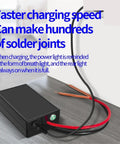 Handheld DIY Spot Welder Kit With 6 Adjustable Amps, featuring charging cables and power indicator, placed on a table