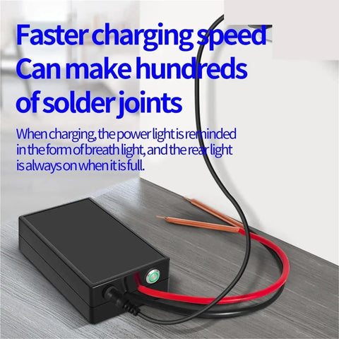 Handheld DIY Spot Welder Kit With 6 Adjustable Amps, featuring charging cables and power indicator, placed on a table