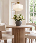 Vintage Brass Milk Glass Pendant Lights Fixture, Pleated Glass Chandelier above a wooden dining table with flowers.