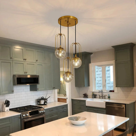 Three Light Mid Century Modern Pendant Light Fixture With Gold Finish Glass Globe And Adjustable Cage Hanging Chandelier in kitchen