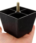 Adjustable Square Furniture Feet With Threaded Foot Pads, 8 Pack, held in hand showing metal thread and black plastic base.
