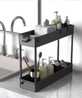 Slim Four Tier Storage Cart Rolling Organizer near sink holding toiletries in black, narrow gaps shelving unit for kitchen bathroom