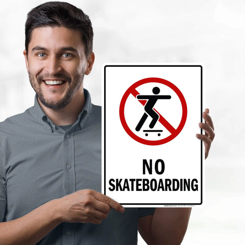 Man holding No Skateboarding Sign 10x14 Inches Built From Rust Free Aluminum Weatherproof Fade Resistant Outdoor Sign For Shops Yards