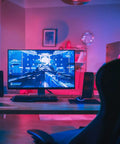 Smart LED Tape Strips 16 Ft RGBW Dimmable WiFi Light illuminating a gaming setup in a dark room