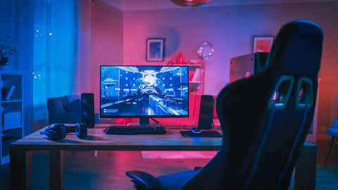 Smart LED Tape Strips 16 Ft RGBW Dimmable WiFi Light illuminating a gaming setup in a dark room