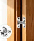 Slick Hidden Cabinet Door Hinge Set Of Three With Screws 180 Degree Cross Mount Invisible Overlay Hardware installed on cabinet door.