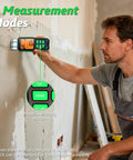 Man using No Sweat Pinless Moisture Meter For Scanning Wood Drywall And Concrete Without Holes Or Marks for measurements.
