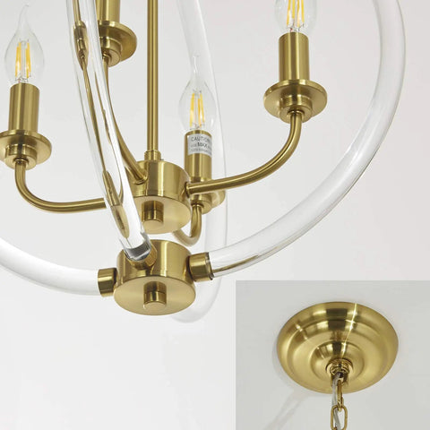Modern Four Light Pendant Chandelier With Clear Acrylic Globes And Brass Finish in dope farmhouse style close-up with chain detail