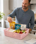 Man using pink tray from Six Pack Plastic Turn In Paper Trays Set For Classroom Storage And Office Organization In Pastel Colors