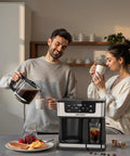 Two people enjoying coffee with a 12 Cup Programmable Dual Coffee Maker With Single Serve And Multi Brew Modes For K Cup Pods.