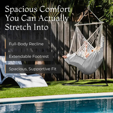 Chill Out In A Cozy Full Body Hammock Chair With Foot Rest For Indoor Outdoor Relaxation by a backyard pool