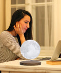 Dope Levitating Moon Lamp With Magnetic Floating Base, 3 Color Modes, on desk with woman using laptop in home workspace
