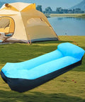 Inflatable Lounger Camping Couch For Adults And Kids, Air Sofa Chair, Portable Blue Outdoor Lounger beside tent