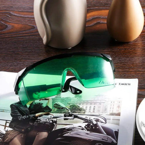 Green Laser Safety Glasses 2 Pack For UV And Infrared Protection With Adjustable Frames on a magazine