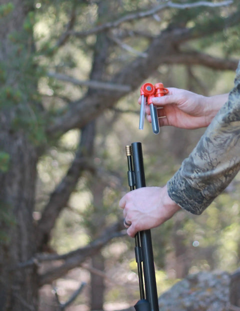 Person holding Pocket Ready Muzzleloader Quick Loader Kit With BH209 Tubes And Funnel
