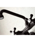 Victorian Style Two Handle Wall Mount Kitchen Faucet in Oil Rubbed Bronze, 7 Inch spout close-up, classic old school design