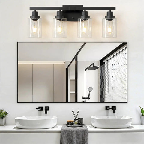 Top Shelf 4 Light Bathroom Vanity Light With Clear Glass Sleeves Matte Black Vintage Wall Sconce above modern sinks and mirror.