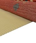 Eco Friendly Non-Slip Rug Pad For Area Rugs And Runners With Extra Cushion Breathable Design To Prevent Bunching And Odor Made From 100 Percent Plant Based Oils Easy Vacuuming Grippy Grip Ex 6'7" X 9'6" shown securing a colorful area rug