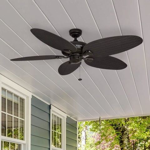 Duval 52 Inch Indoor Outdoor Ceiling Fan With Hand Carved Basswood Blades, Bronze Finish, installed on a porch ceiling