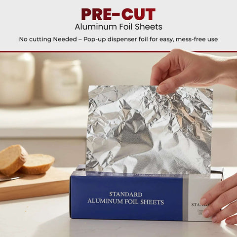 Hand pulling No Fuss Pre Cut Aluminum Foil Sheets In Pop Up Dispenser 9 Inch By 10.75 Inch 500 Count for quick food wrapping.