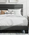 Full Platform Bed Frame With Upholstered Fabric Headboard In Grey Featuring Dense Foam Padding And Breathable Polyester For Super Comfy Nights, with pillows and white bedding.