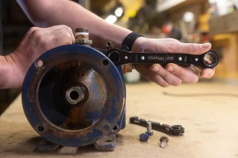 Using 8-In-1 SAE Ratcheting Wrench Set In Two Pieces With Hollow Sockets And Double Box End Design on rusty machinery