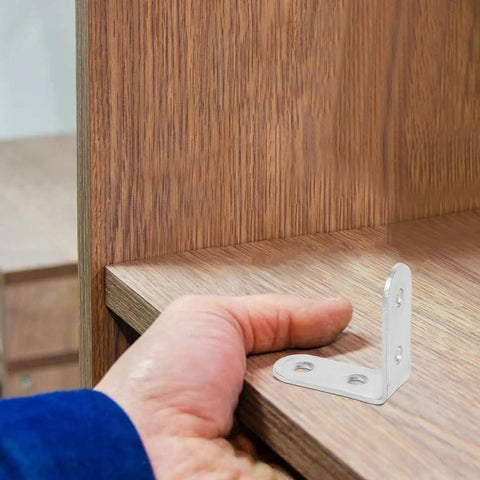 Hand holding a wooden shelf with Beefy Heavy Duty L Brackets Set With Screws, 16 Pack Cold Rolled Steel Corner Brackets for support