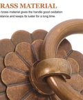 Close-up of vintage brass ring pull handle showcasing detailed design and material for durability.