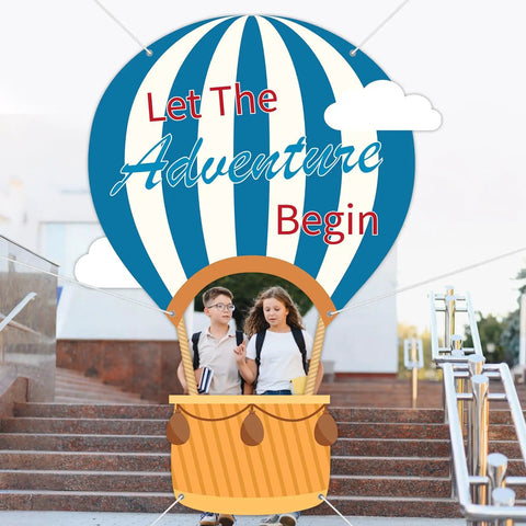 Epic 78 Inch Hot Air Balloon Photo Booth Frame Travel Theme Selfie Prop Great For Kids Birthday Parties Baby Showers Graduation And Back To School Classroom Decor Or Any Photo Backdrop with "Let the Adventure Begin" text and students in basket.