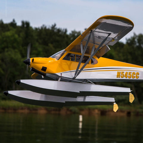 Carbon Cub 15cc ARF Ready To Fly RC Plane with laser cut wood floats and tundra style wheels above water