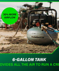 The Tank Portable Pancake Air Compressor 200 PSI 6 Gallon Tank on jobsite with hose attached