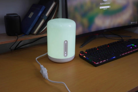 Short White Indoor Extension Cord Two Foot, Polarized 2 Prong NEMA 5-15P to 5-15R connected to a desk lamp